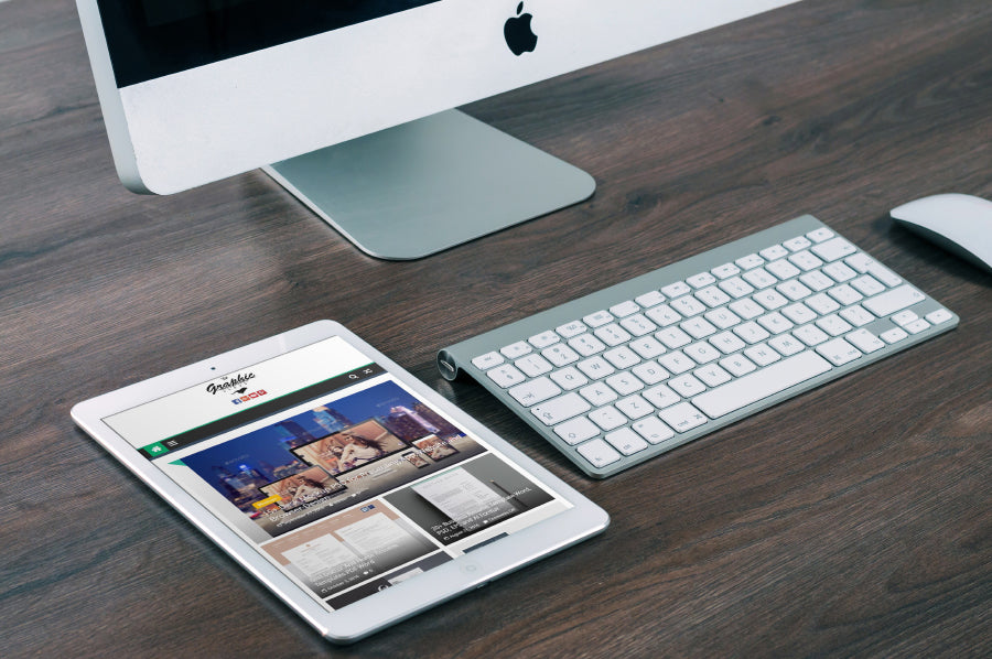 Free Man or Woman Holding a Set of iPad PSD Mockups