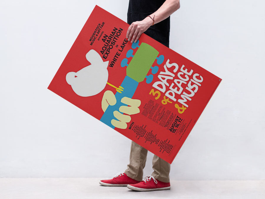 Free Man Holding Poster or Flyer PSD Mockup