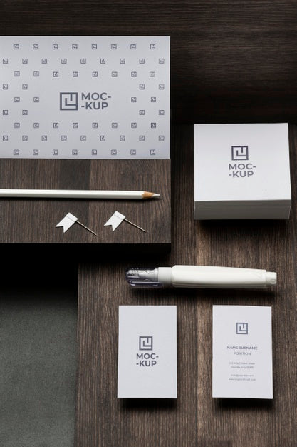 Free Arrangement Of Mock-Up Stationery On Wood Psd