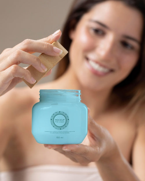 Free Beautiful Smiley Woman Holding Cream Jar Mock-Up Psd