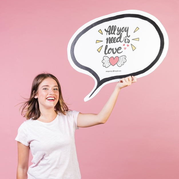 Free Beautiful Young Woman Holding Up A Board Mock-Up Psd