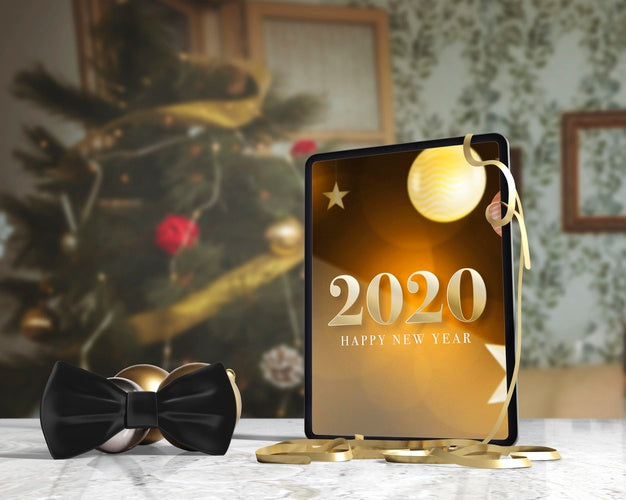 Free Bow Tie Beside Tablet With Message For New Yeah Psd