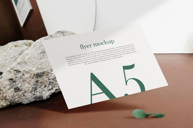 Free Clean Minimal A5 Flyer Mockup Floating On Top Wood Background With Leaves. Psd File. Psd