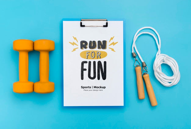 Free Clipboard With Jumping Rope And Weights Beside Psd