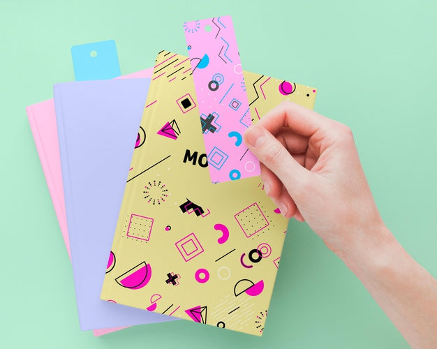 Free Close-Up Hand Holding Bookmark Psd