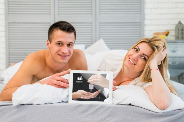 Free Couple In Bed With Tablet Mockup For Valentine Psd