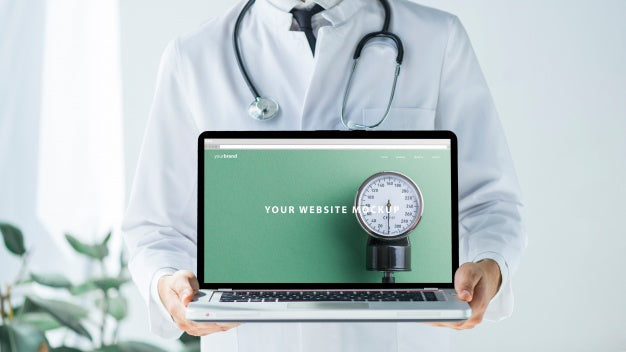 Free Doctor Holding Laptop Mockup For Website Psd