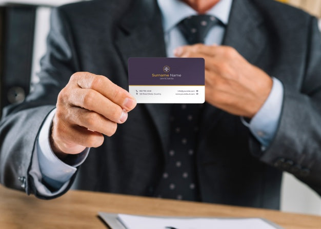 Free Elegant Businessman Presenting Business Card Mocku Psd