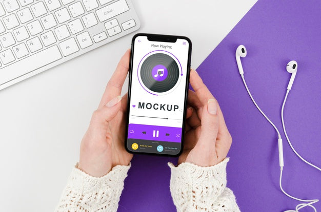 Free Flat Lay Hands Holding Smartphone Mock-Up With Earphones Psd