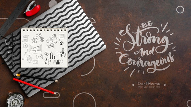 Free Flat Lay Of Desk Surface With Notebook And Pencils Psd