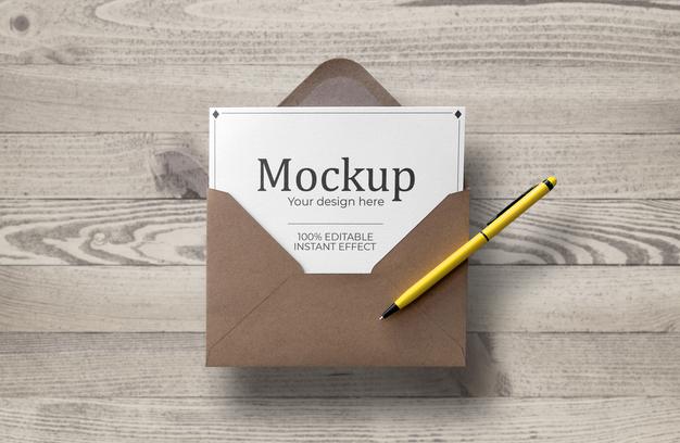 Free Floating Enveloped Card Over Wood Surface Mockup Psd