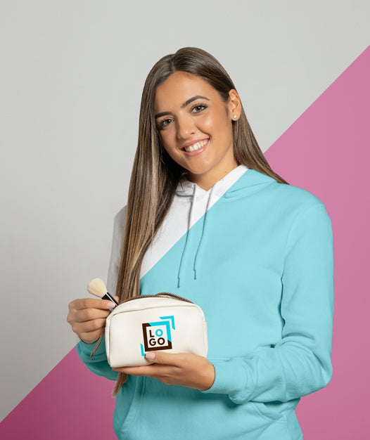 Free Front View Of Woman In Hoodie Holding Make-Up Pouch Psd