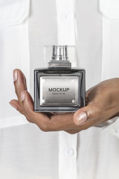 Free Hands Holding Blank Perfume Glass Bottle Mockup Psd
