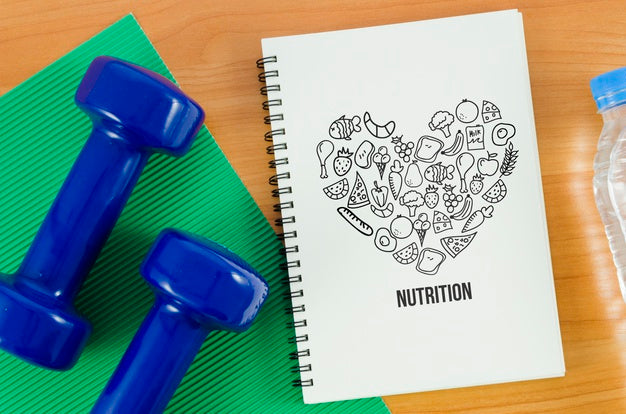 Free Hands Weights Beside Notebook Psd