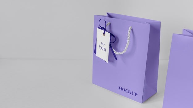 Free High Angle Of Paper Shopping Bag Mock-Up With Paper Tag Psd