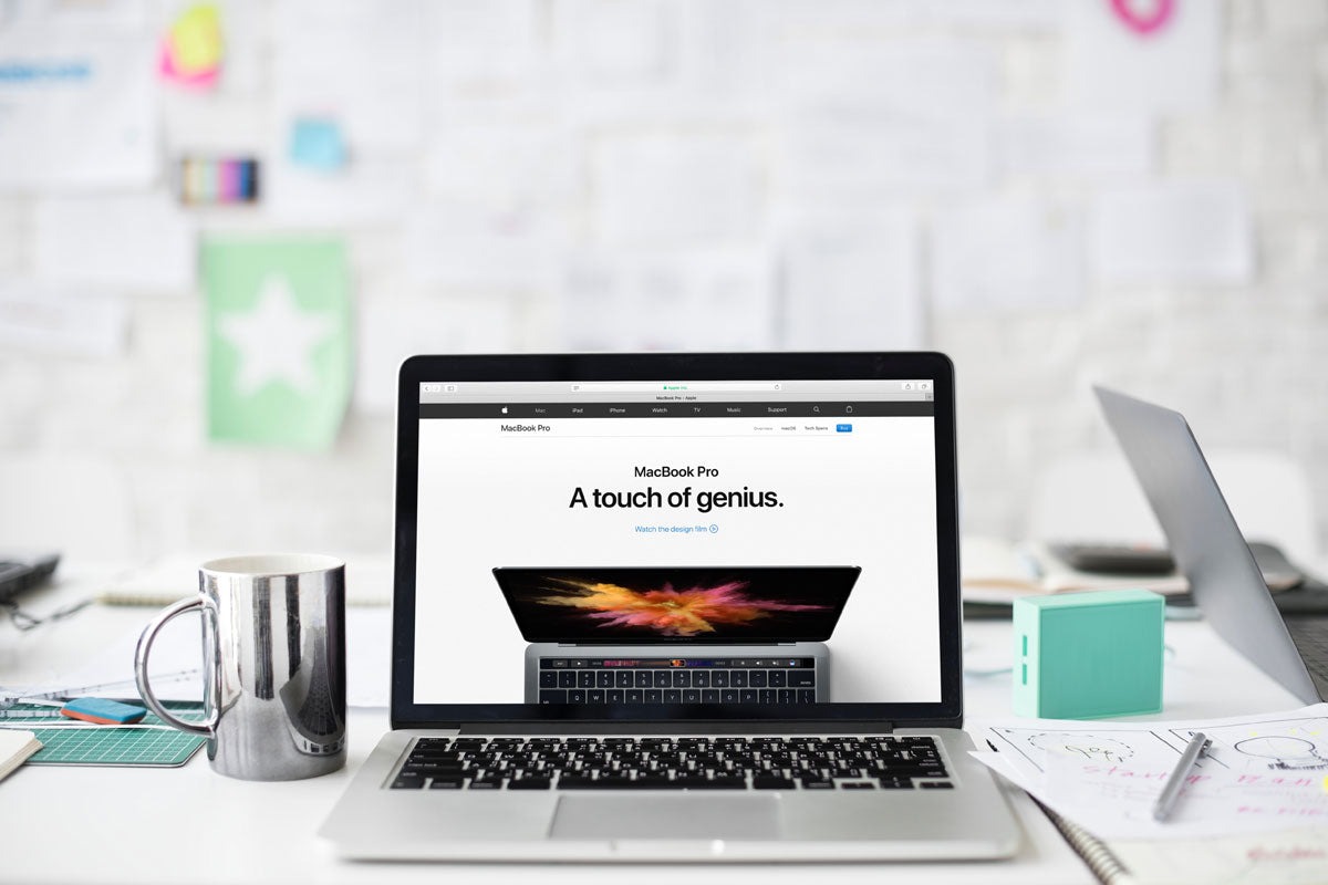 Free Macbook Pro And A Tea Cup On Office Desk