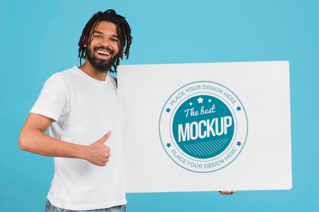 Free Man Holding Poster Mockup Psd