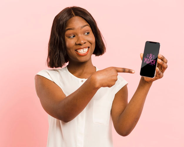 Free Medium Shot Woman Pointing At Her Smartphone Psd