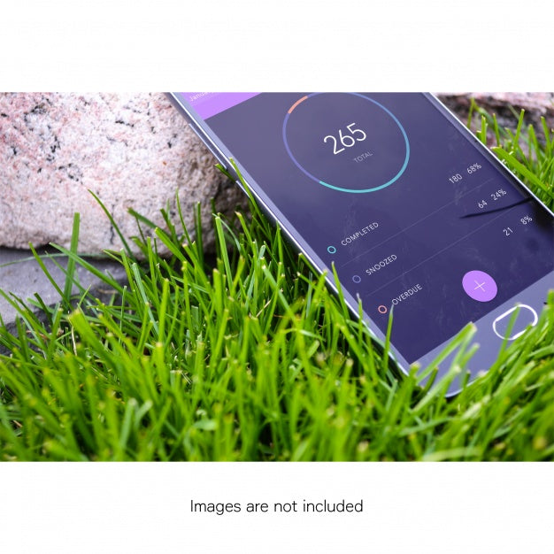 Free Mobile Phone On Grass Mock Up Psd