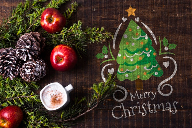 Free Mock-Up Coronet Branches With Apple And Drink On Table Psd