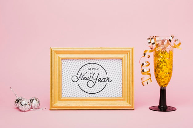 Free New Year Lettering With Golden Confetti In Glass Psd