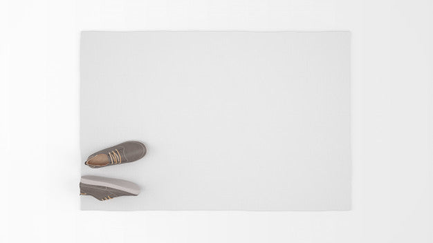 Free Realistic White Carpet With A Pair Of Shoes On Top View Psd