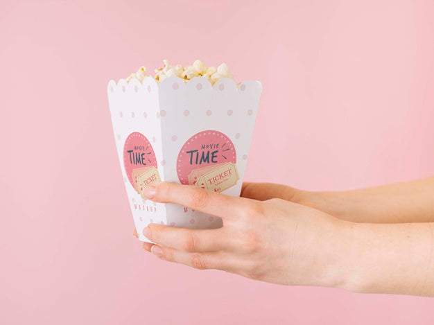 Free Side View Of Hands Holding Popcorn Cup Psd