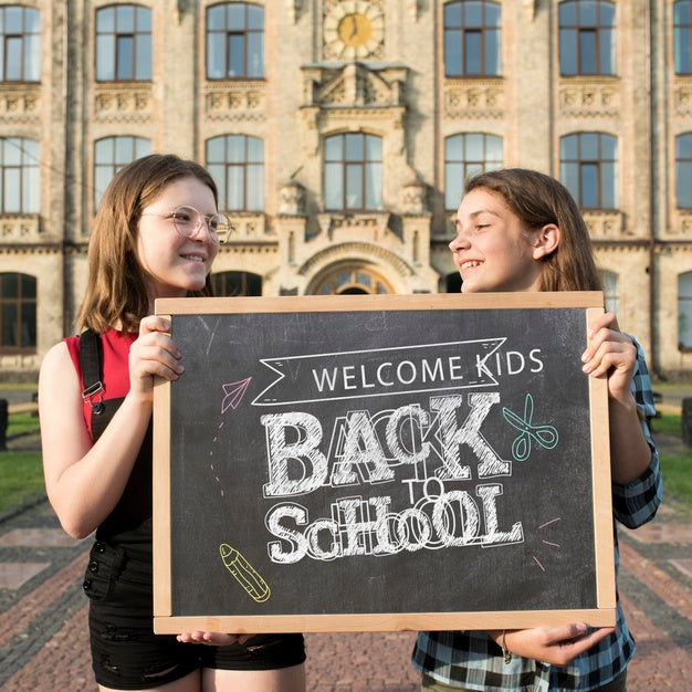 Free Smiley Girls Holding A Blackboard Mock-Up Psd