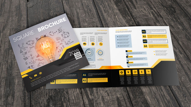 Free Square Brochure Mockup On Wooden Surface Psd