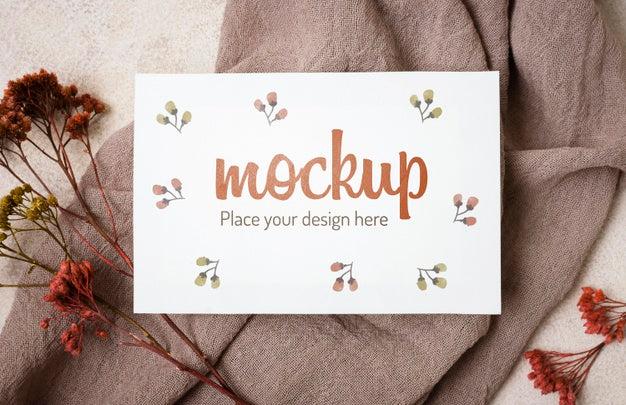 Free Top View Autumn Mock-Up With Flowers On Grey Cloth Psd