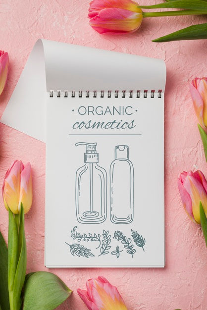 Free Top View Cosmetics Mockup With Flowers Psd