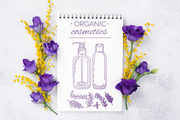 Free Top View Cosmetics Mockup With Flowers Psd