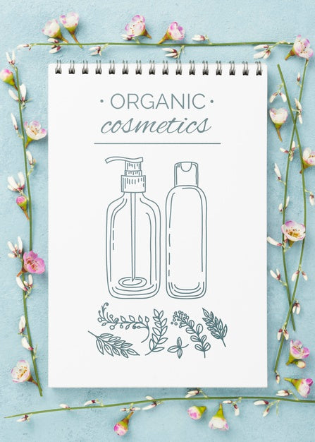 Free Top View Cosmetics Mockup With Flowers Psd