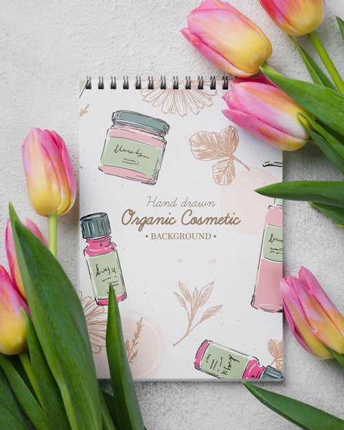 Free Top View Cosmetics Mockup With Flowers Psd