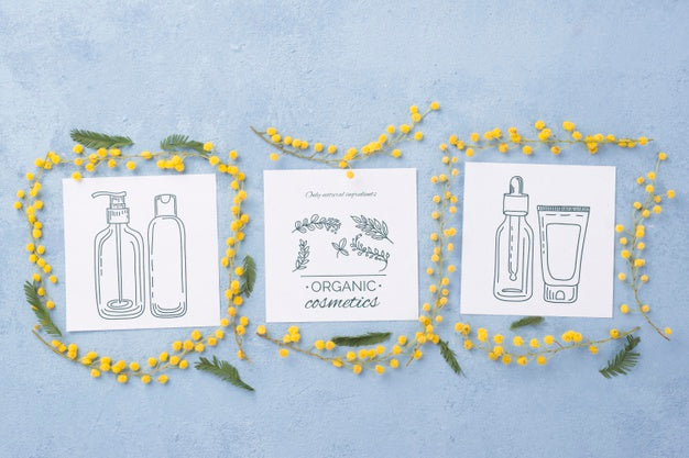 Free Top View Cosmetics Mockup With Flowers Psd