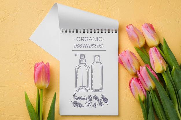 Free Top View Cosmetics Mockup With Flowers Psd