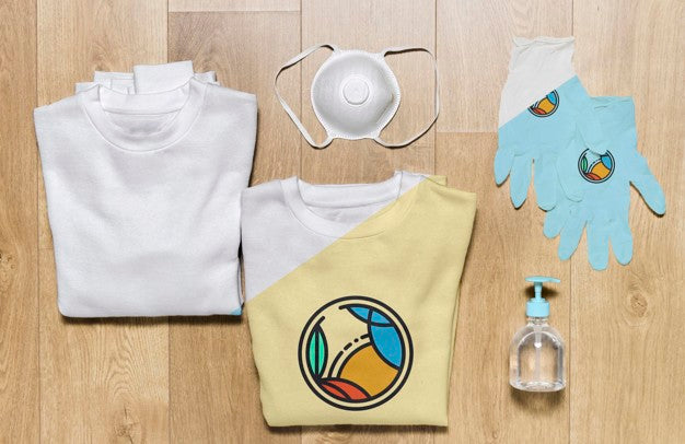 Free Top View Folded Hoodies Mock-Up With Gloves, Mask And Hand Sanitizer Psd