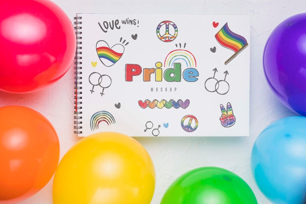 Free Top View Of Colorful Balloons With Notebook Psd