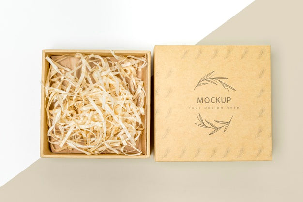 Free Top View Of Eco-Friendly Gift Box With Shredded Paper Mock-Up Psd