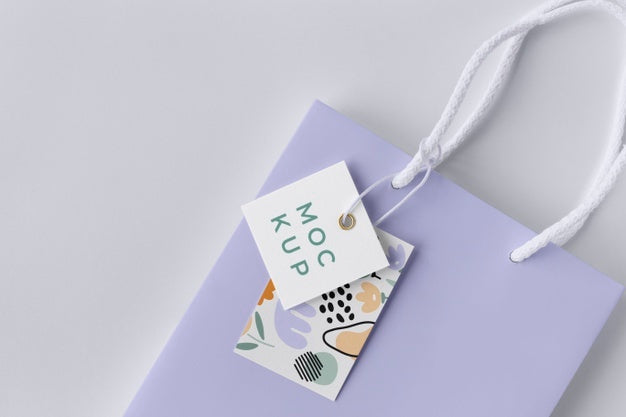 Free Top View Of Paper Shopping Bag Mock-Up With Paper Tag Psd