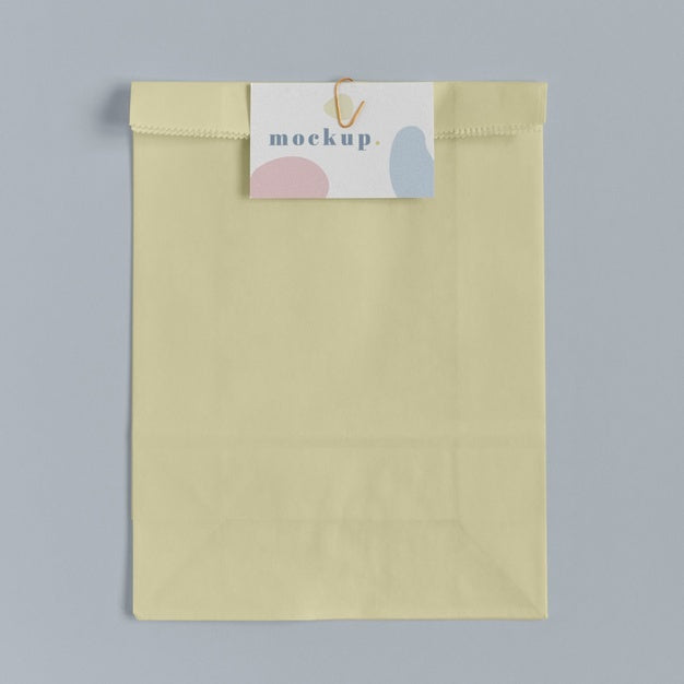 Free Top View Of Paper Shopping Bag Mock-Up With Paper Tag Psd