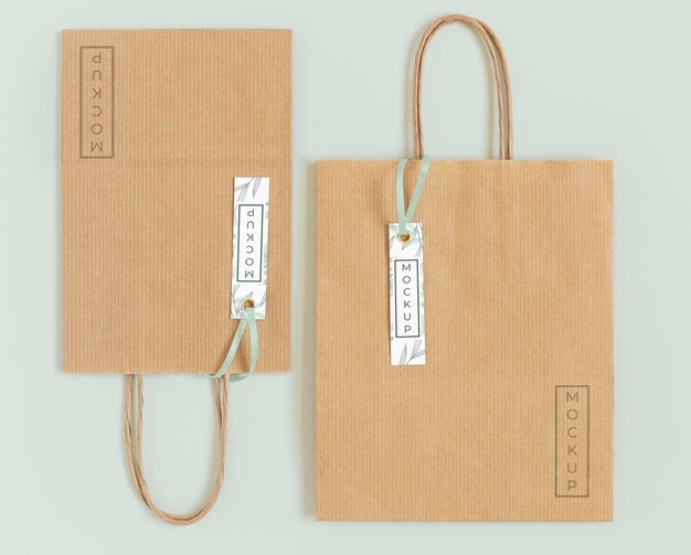 Free Top View Of Paper Shopping Bag Mock-Up With Paper Tag Psd