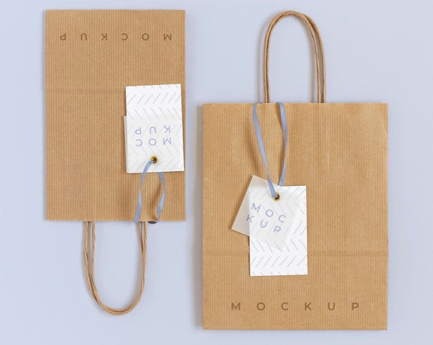 Free Top View Of Paper Shopping Bag Mock-Up With Paper Tag Psd