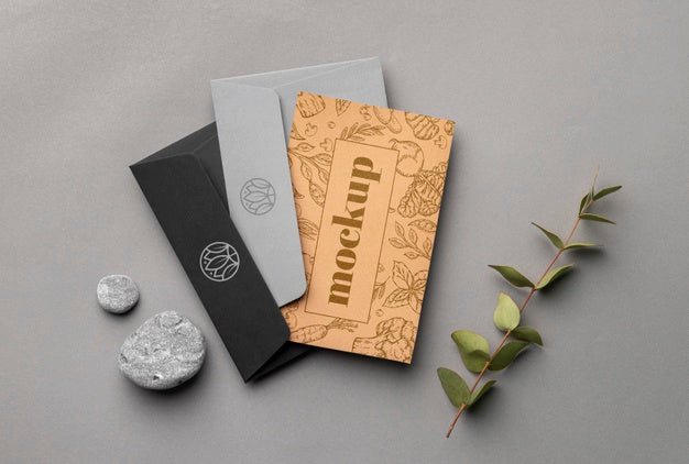 Free Top View Of Paper Stationery With Leaves And Rocks Psd