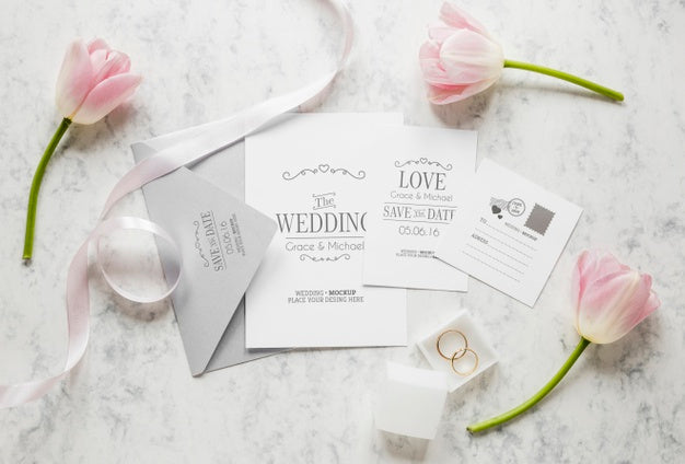 Free Top View Of Wedding Cards With Envelope And Flowers Psd