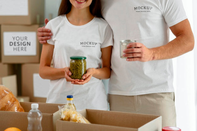 Free Volunteers Posing Together While Preparing Boxes Of Provisions For Donations Psd