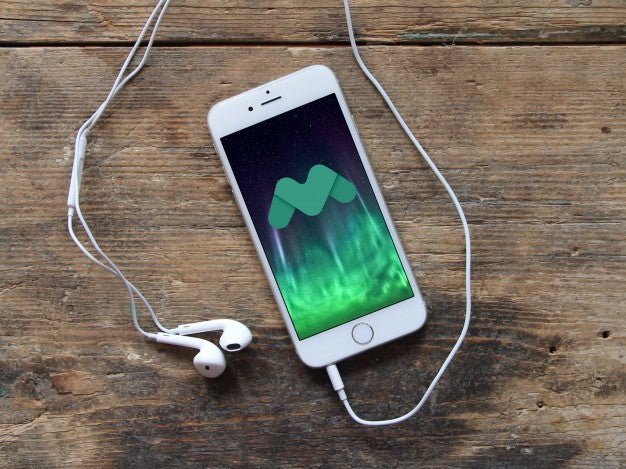 Free White iPhone 7 on Wooden Table Psd Mockup