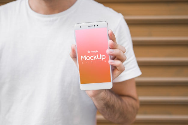 Free Young Man With A Smartphone Mockup Psd
