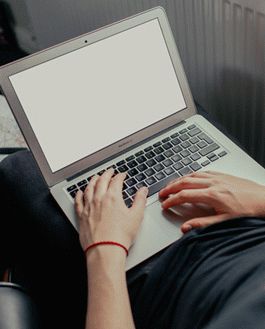 Free Young Man Working On His Macbook Air