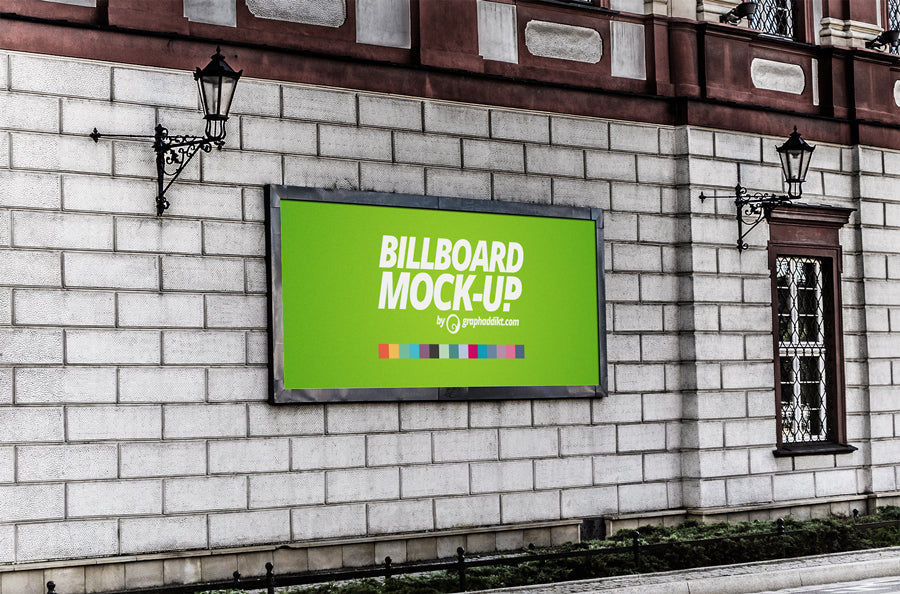 Free Billboard Sign in a Brick Wall Poster Mockup